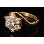 An 18ct hallmarked diamond cluster ring,