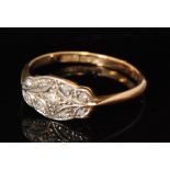 An Edwardian 18ct diamond ring, illusion set oval head detailed with nine diamonds, weight 1.