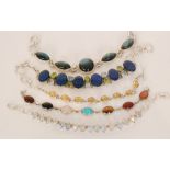 A small collection of various stone set silver and white metal bracelets to inlcude labradorite,