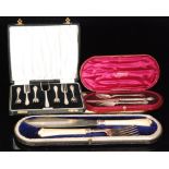 A cased set of silver hallmarked silver cake forks,