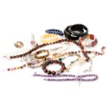 A quantity of beads to include amethyst, tigers eye, black onyx, bracelets, two ladies watches etc.