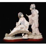 A large Lladro tableau Springtime in Japan modelled with two geisha girls on a bridge,