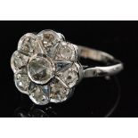 A 9ct white gold diamond cluster ring nine rose cut diamonds to a shaped circular head and plain