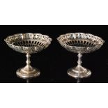A pair of hallmarked silver pedestal bon bon dishes each with pierced circular bowls, diameter 13cm,