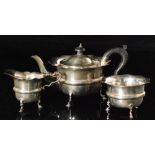 A hallmarked silver three piece tea service composed of teapot, sugar bowl and cream jug,