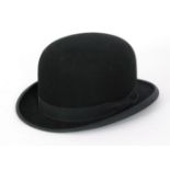 A bowler hat by G A Dunn & Co limited, the circumference of the interior measures 56cm.