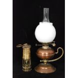 A 20th Century copper chamber stick hand oil lamp with chimney and white opaque shade,