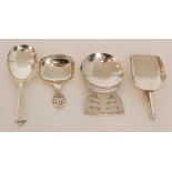 An Art Deco hallmarked silver caddy spoon with plain shovel bowl and geometric terminal,