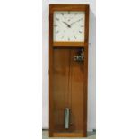 A 20th Century ITR mahogany cased rewind impulse clock with barrel pendulum enclosed by a glazed