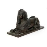 A 19th Century bronze model of a sphinx with hieroglyphic detail on rectangular plinth base,