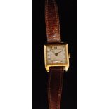 A 1920s 18ct Rolex Prima lady's manual wind wristwatch the square ivory dial with black Arabic