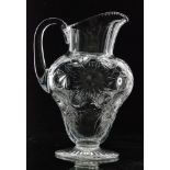 An early 20th Century Thomas Webb & Sons clear crystal water jug of footed baluster form with