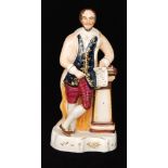 A 19th Century Staffordshire figure modelled as Shakespeare leaning on a pedestal and holding a