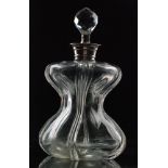 An early 20th Century Stevens & Williams clear crystal glass Grotesque decanter of waisted form