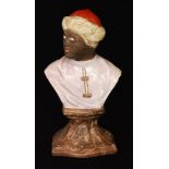 An early 19th Century Staffordshire pearl ware bust of Othello raised to a faux marble pedestal