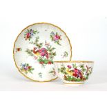 A late 18th Century Worcester scalloped edge tea bowl and saucer decorated in the Fancy Bird