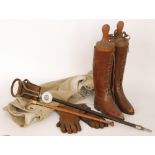 A pair of lady's brown leather riding boots with trees and spurs,