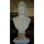 A late 19th Century marble bust of an elderly lady wearing a portrait necklace to her neck on
