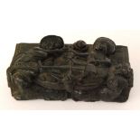A 19th Century Dutch carved ebonised oak snuff box depicting a medieval scene of two reclining