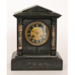 A Victorian slate mantle clock with marble pilaster columns above a plinth base,