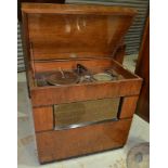 A 1930s walnut cased radiogram, fitted with a Garrard deck and dial indicator and ebonite controls,