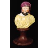 An early 19th Century Staffordshire pearl ware bust of Chaucer raised to a socle base,