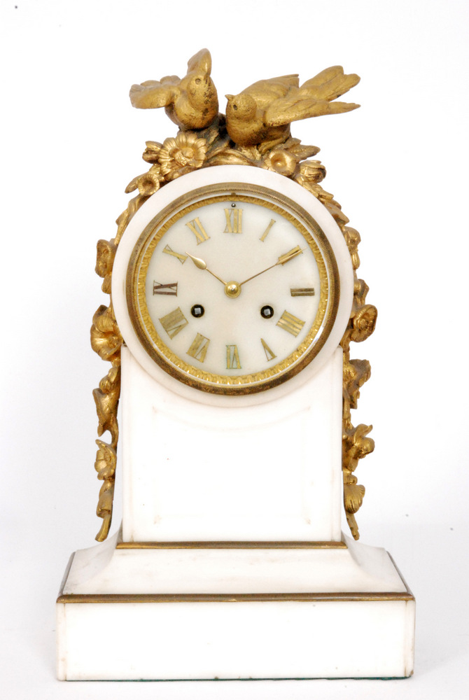 A 19th Century white marble and ormulu mounted mantle clock decorated with birds and flowers,
