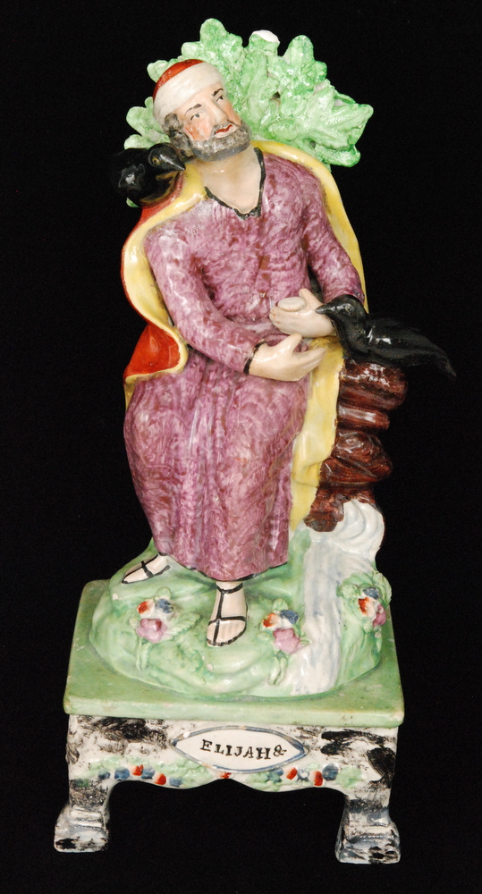 An early 19th Century Staffordshire figural pair modelled as Elijah and the Widow, - Image 2 of 3