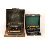 A 20th Century Empire No 2 typewriter on wooden base enclosed by a metal case together with a later