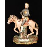A 19th Century Staffordshire equestrian figure of Don Quixote, titled to the naturalistic base,