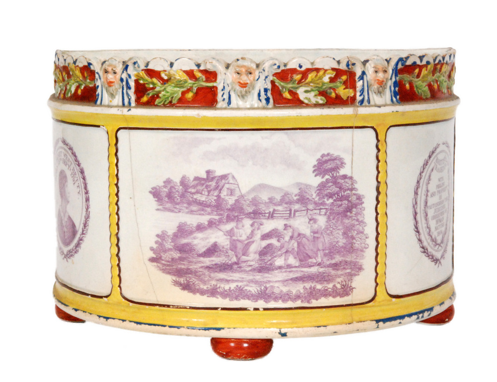 An early 19th Century pearlware semi-circular footed planter decorated with three mauve transfer