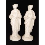 A pair of 19th Century Parian figures of classical ladies each stood on circular bases with