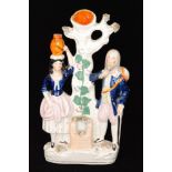 A 19th Century Staffordshire flatback modelled as Rebekah and Abraham's servant at the well,