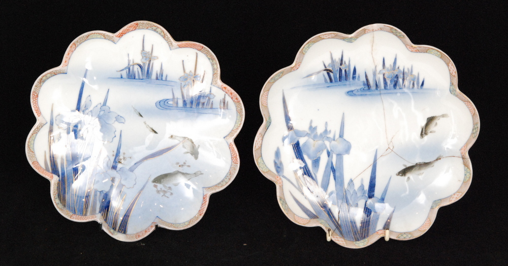 A pair of early 20th Century Japanese cabinet plates each decorated with carp and iris in tones of