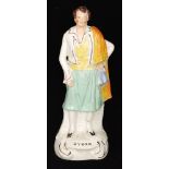 A 19th Century Staffordshire portrait figure of Lord Byron stood with a yellow shawl draped over
