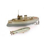 An early 20th Century Sutcliffe tin plate clockwork 'Valiant' battleship, retains box and key, S/D,