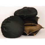 Three braided edge dark green cushions and two circular black cushions (5)