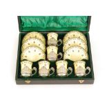 An early 20th Century cased Royal Worcester coffee set comprising six cans and six saucers each