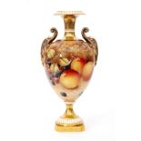 A Royal Worcester Fallen Fruits twin handled pedestal vase decorated in the round with hand painted