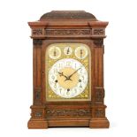 An early 20th Century oak cased bracket clock, with garland cornice,