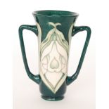 A Moorcroft Pottery Collectors Club twin handled vase decorated in the Snowdrops pattern,