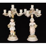 A pair of late 19th Century Sitzendorf four branch candelabra,