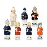 Seven assorted 19th Century Staffordshire condiments formed as Policemen each holding a truncheon,