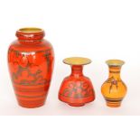 Two post war Gouda Tokio range vases, both in a bright red with a tonal black pattern, tallest 29cm,