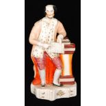 A 19th Century Staffordshire portrait figure modelled as William Shakespeare stood leaning on a