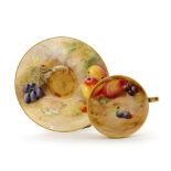 A Royal Worcester Fallen Fruits matched cabinet cup and saucer,