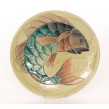 A Moorcroft Pottery 1989 cabinet plate decorated with a tubelined carp against a green ground,