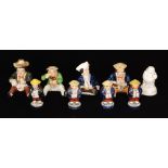 Nine assorted 19th Century Staffordshire figures comprising four seated figures, one taking snuff,