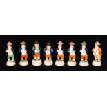 Eight assorted 19th Century Staffordshire pepper pots formed as Toby,