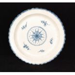 A large late 18th to early 19th Century creamware scalloped edge dish decorated in blue and white